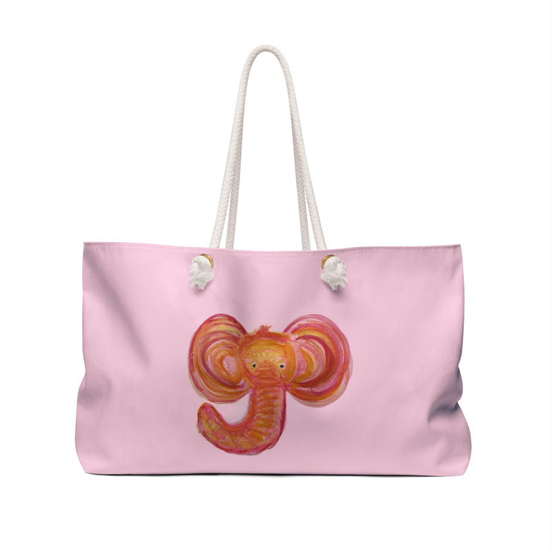 A light pink canvas tote bag with white rope handles, featuring a stylized watercolor mom elephant head graphic in shades of orange, red, and yellow on the front.