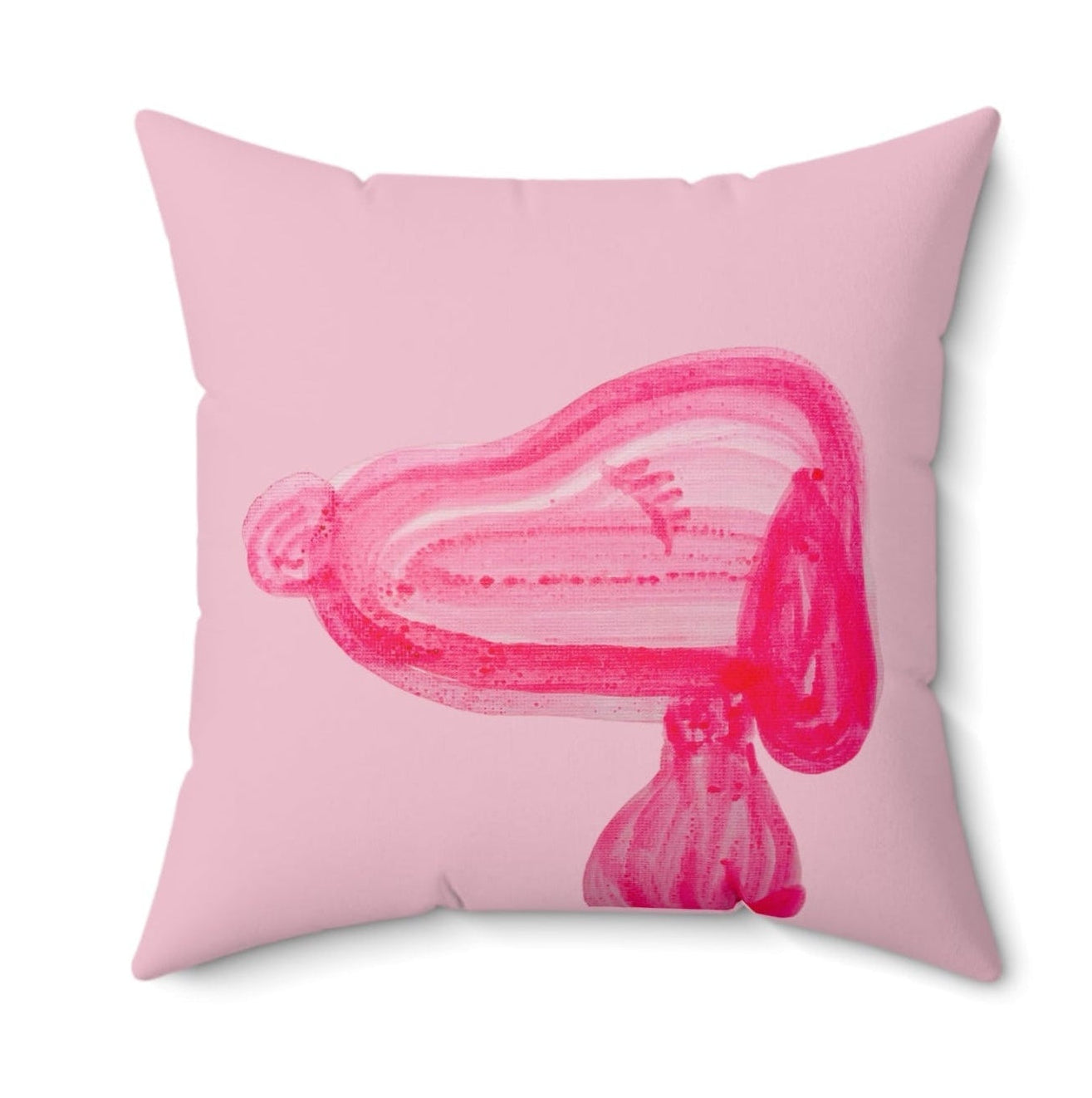 Pink pillow with a stylized pink design on a white background