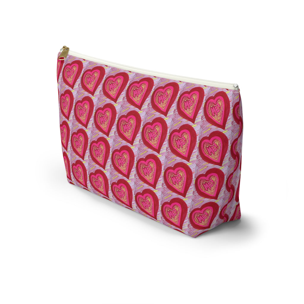 A rectangular zippered pouch with a repeating pattern of red and pink hearts on a light purple background, featuring a gold-tone zipper. Travel bag, makeup bag, art bag