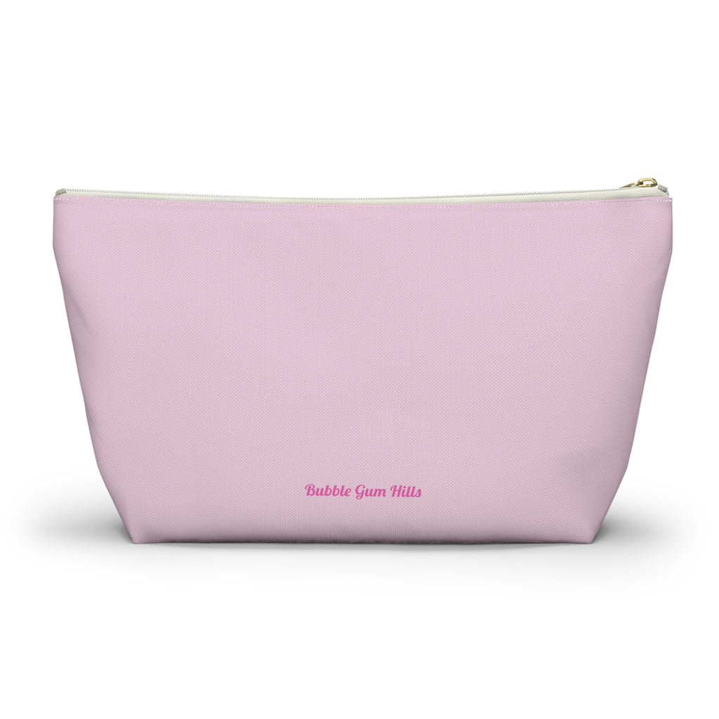 Cute travel makeup bag for dancers showing a wide, self-standing T-bottom structure. Holds makeup, hair pins, bandais, and more