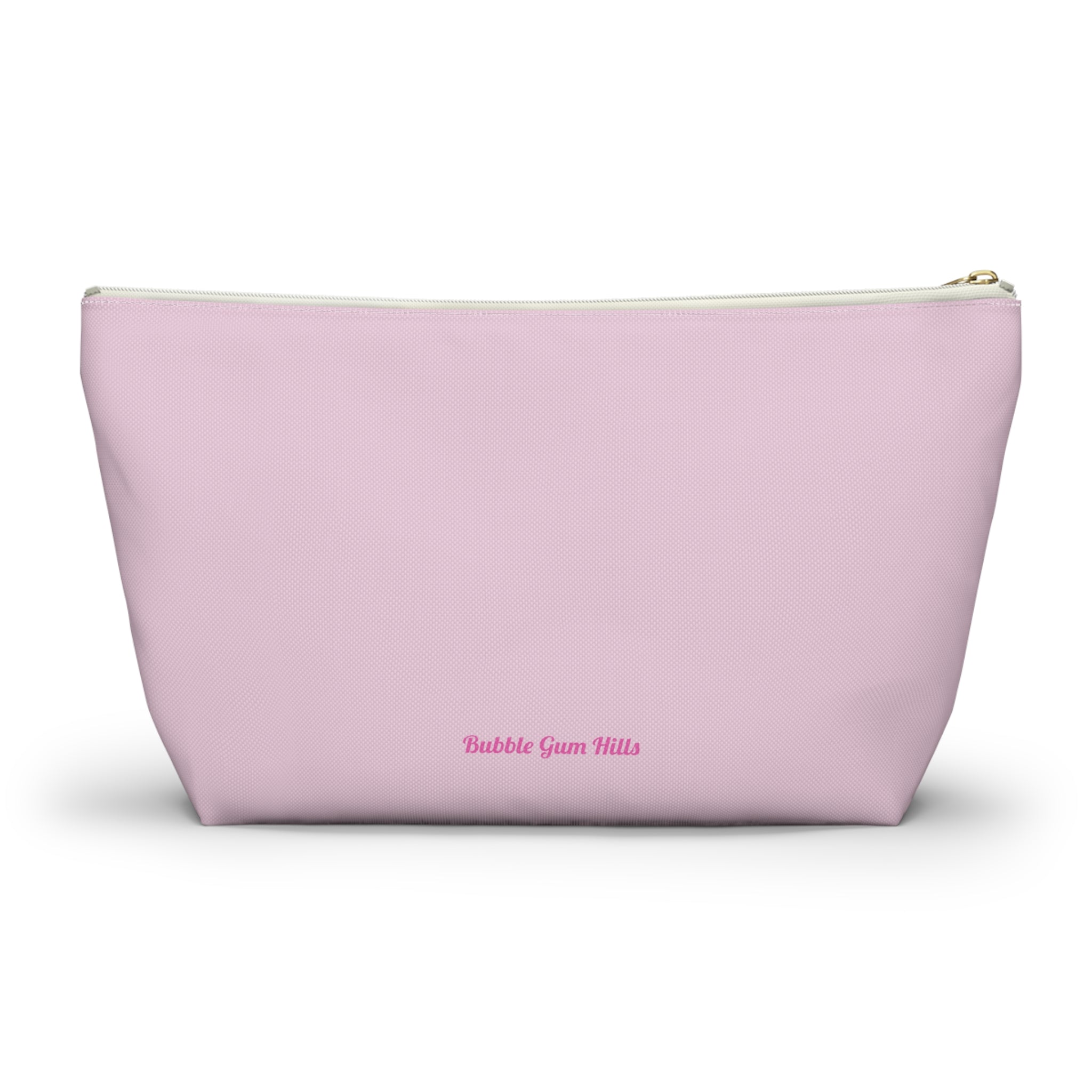 Cute travel makeup bag for dancers showing a wide, self-standing T-bottom structure. Holds makeup, hair pins, bandais, and more