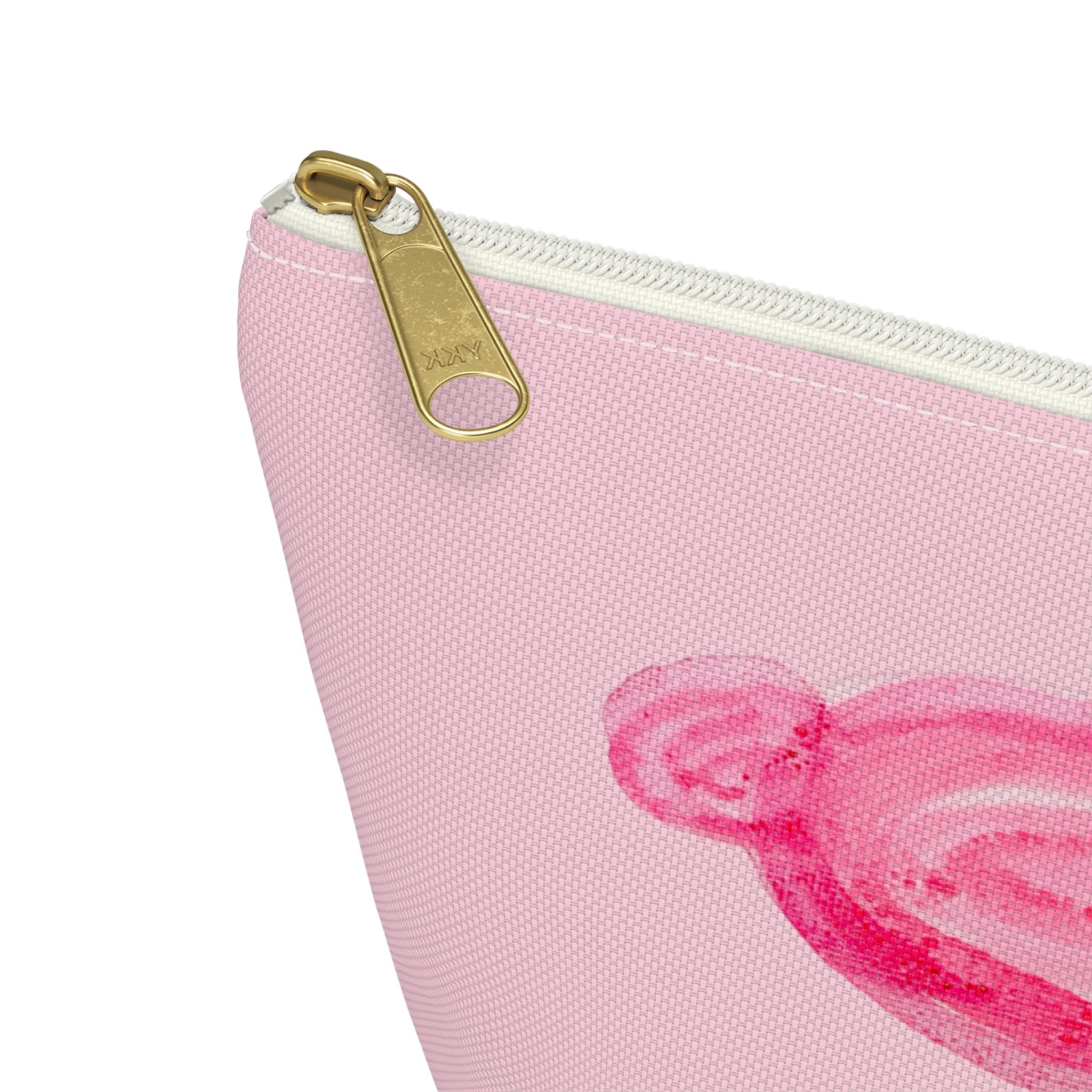 Cute travel makeup bag with a wide T-bottom structure standing upright on a counter