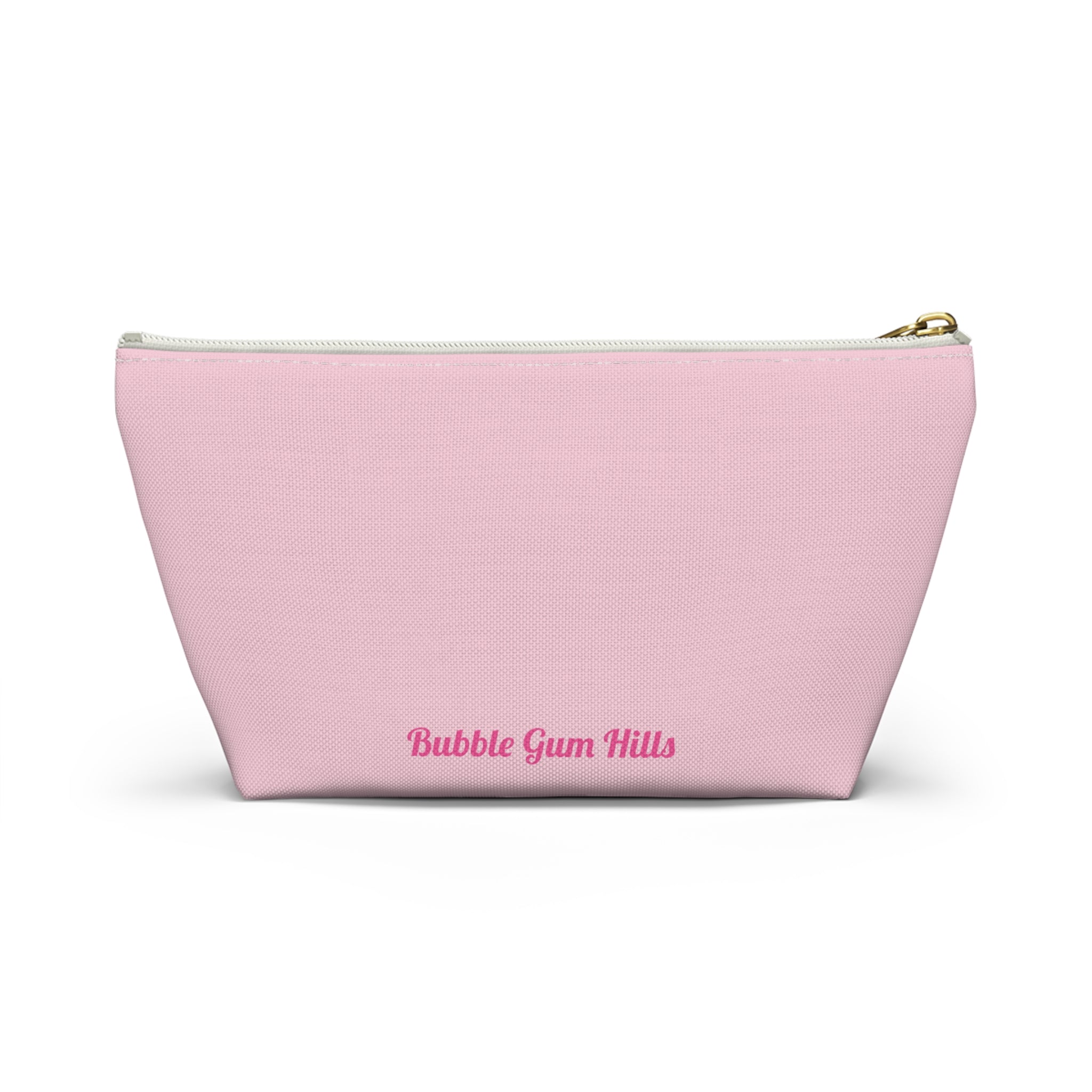 Cute travel makeup bag with a wide T-bottom structure standing upright on a counter