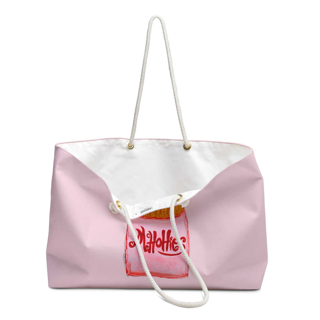 A light pink canvas tote bag with a white interior, white rope handles, and a red hand-drawn style 'Muffin' graphic on the front, shown against a plain white background.