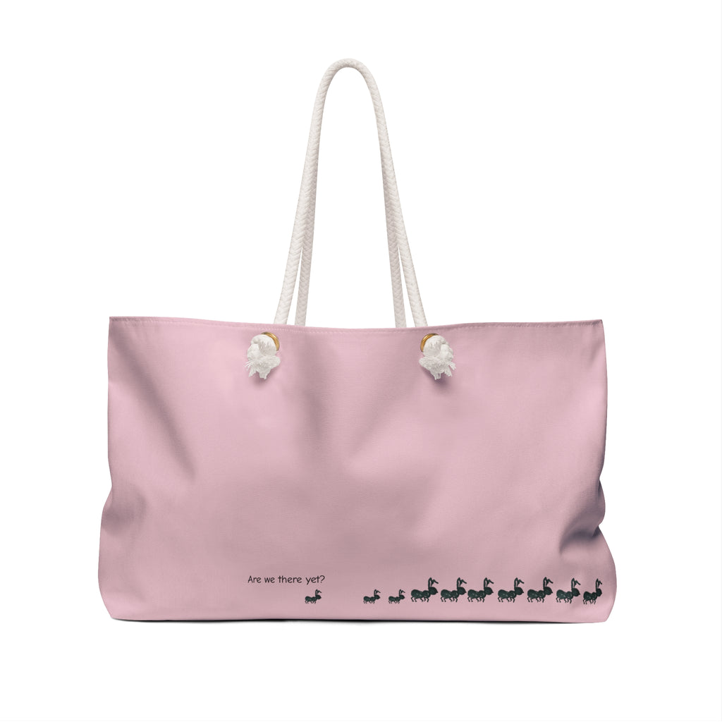 A light pink canvas tote bag with thick white rope handles and small black printed text and figures near the bottom, shown on a plain white background. Kids Fun Bag for Parents