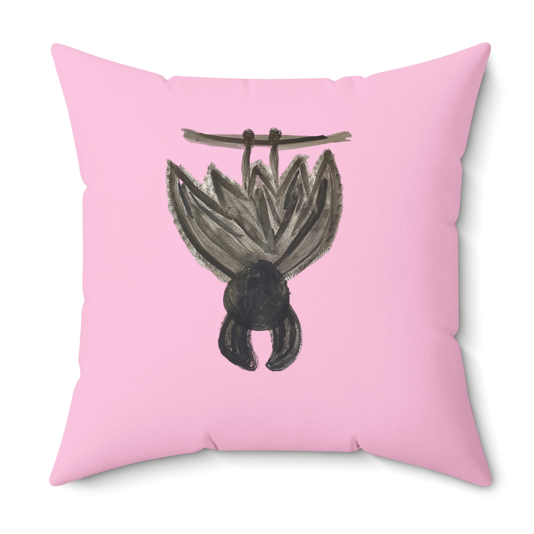 A square pink throw pillow featuring a hand-painted style illustration of a hanging bat in black and gray on the front, set against a plain white background.