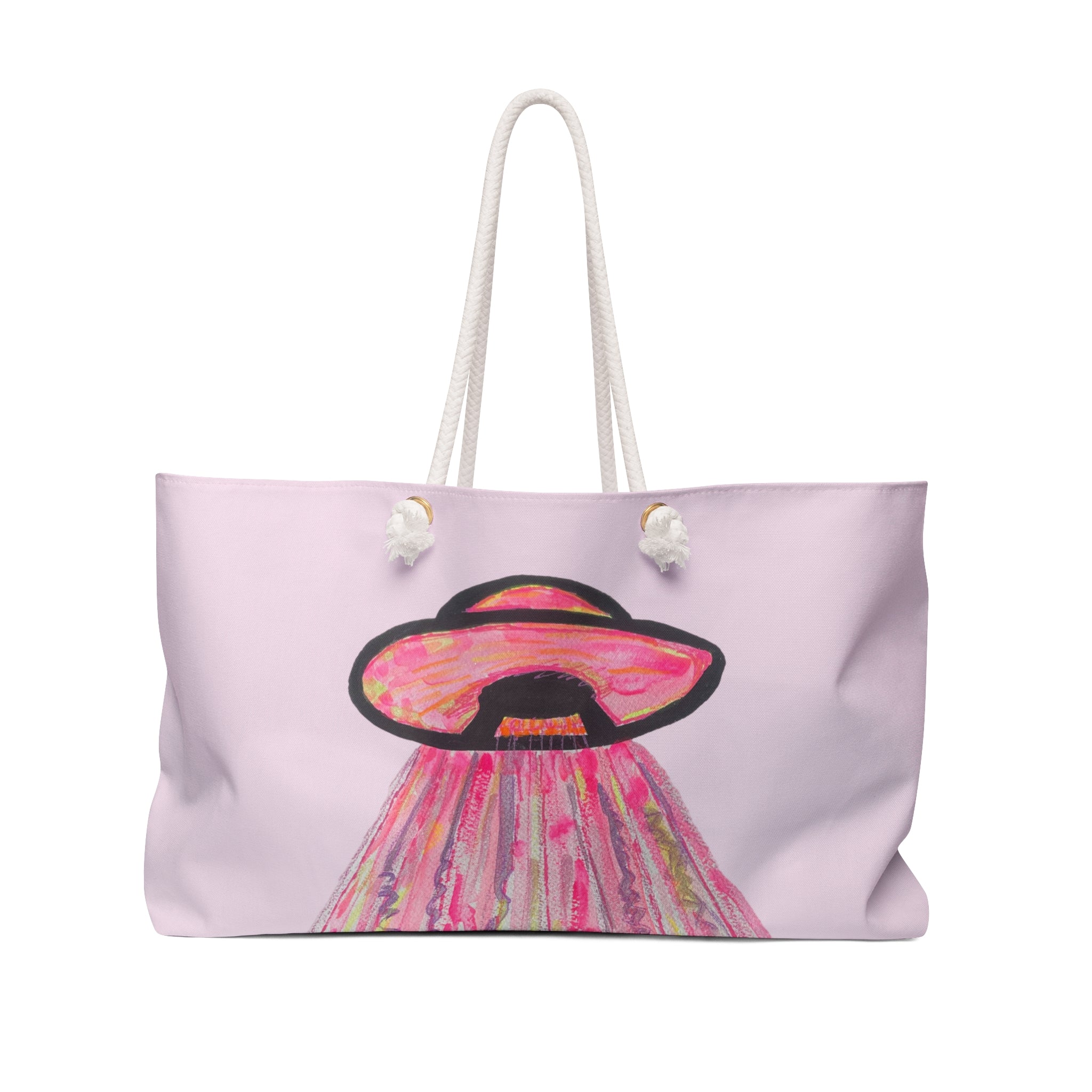 A light pink tote bag with white rope handles, featuring a colorful graphic of a UFO in pink, orange, and black on the front.