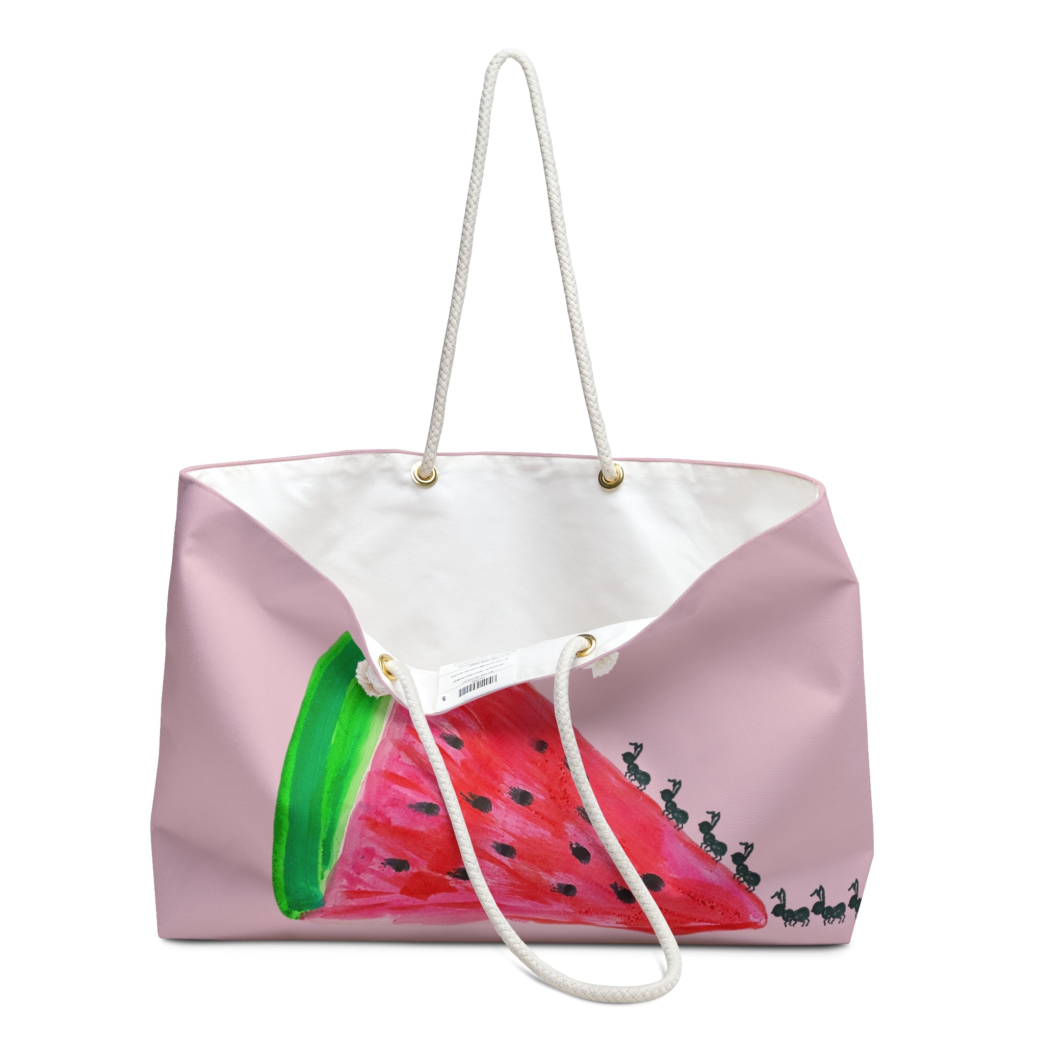 A pink canvas tote bag with a watermelon slice illustration on the front, featuring a white interior, white rope handles, and gold-tone hardware, shown on a plain white background.